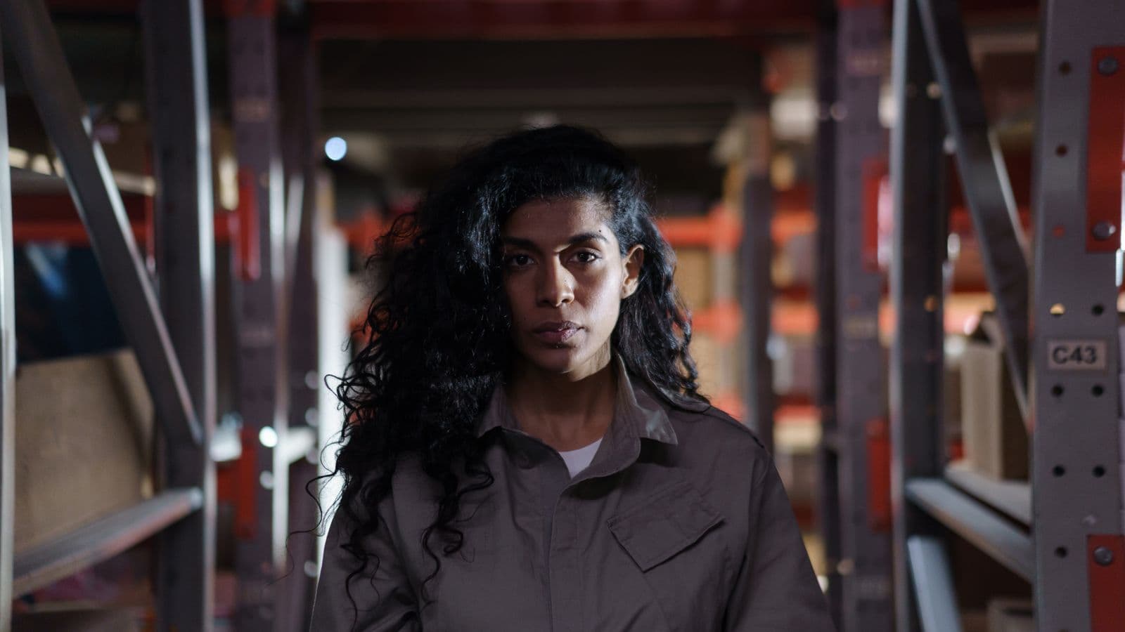 Safety inspector auditing factory records at a warehouse desk