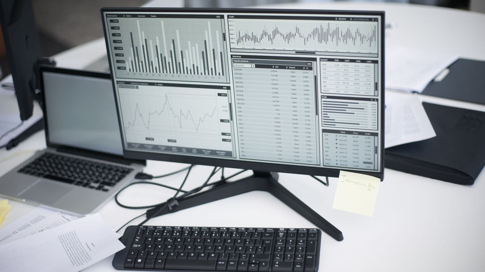 Safety manager reviewing a TRIR calculation spreadsheet with an OSHA 300 Log nearby